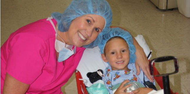 This is a picture of a nurse taking a picture with a patient.