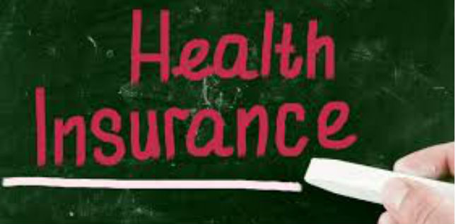 Picture of a chalk board with a persons hand and chalk. It says:
Health Insurance