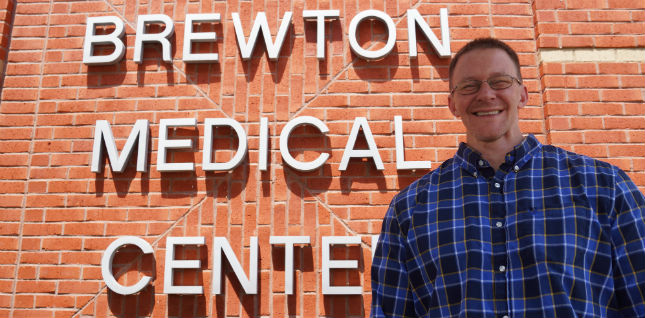 Scott Moore, M.D. standing outside infant of the Brewton Medical Center