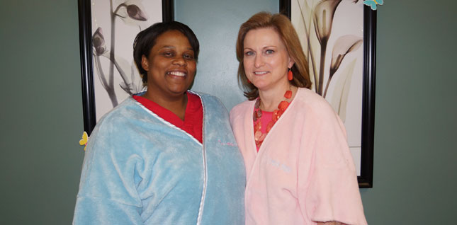 The Women's Center at D. W. McMillan Memorial Staff (2 females) wearing robes.
