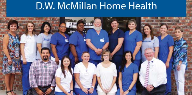 D.W. McMillan Home Health Staff group standing outside of the building smiling