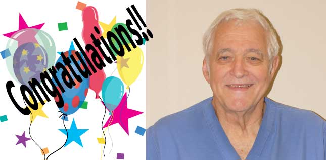 McMillan Memorial Hospital announce the upcoming retirement of Dr. John Vanlandingham.
Picture of him smiling and there is a banner next to his picture that says &quot;Congratulations&quot; with balloons around the banner.