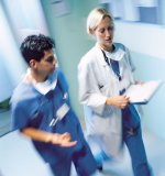 This is a picture of a nurse and doctor walking down a hallway.